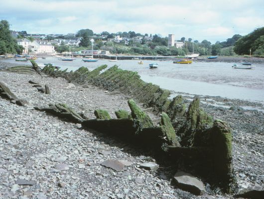 old wooden ship ruin at low tide